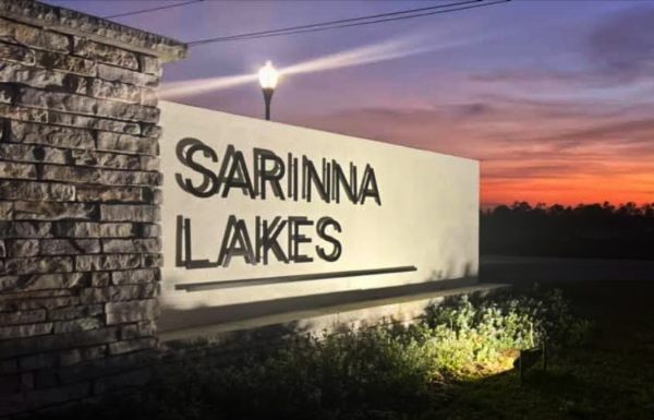 Sarinna Lakes entrance sign at night